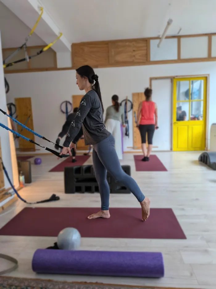 An instructor guiding a client through springboard work